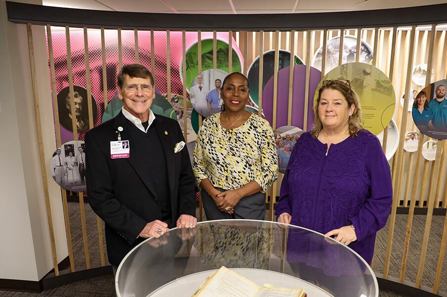 UM Health-Sparrow's Michael Clark, M.D., Deborah Allen and Melissa Herbert celebrate the Heritage Gallery's grand opening.