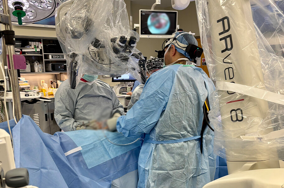 Dr. Karsy and Dr. Yaghi using the neurosurgery MyVeo headset microscopes Dr. Karsy and Dr. Yaghi using the neurosurgery MyVeo headset microscopes