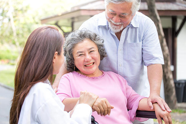 Asian couple with doctor