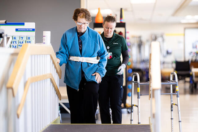 Mary Free Bed Carousel - Woman Walking on Stairs Mary Free Bed Carousel - Woman Walking on Stairs