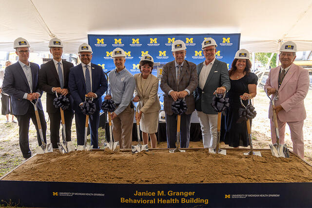 Leaders pose at Behavioral Health Building Groundbreaking