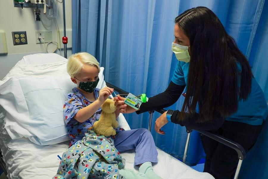 Child Life Specialist Helping Little Boy